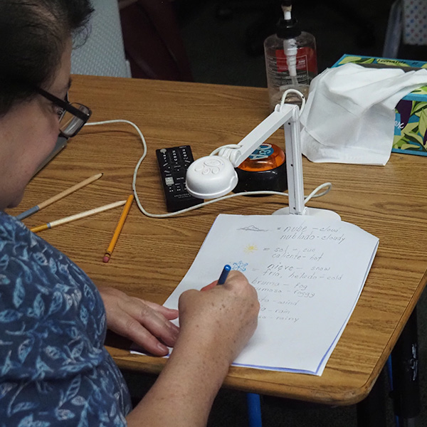 A Spanish Instructor grading an assignment